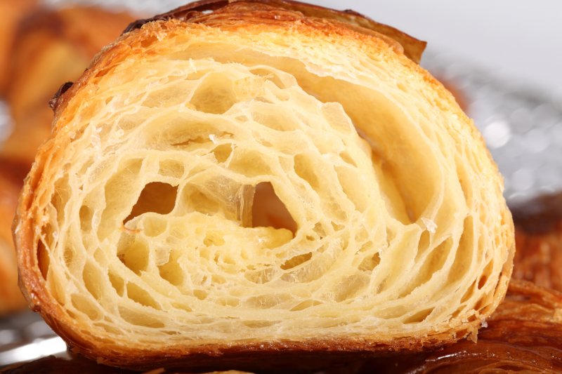 Croissant cross-section showing off flaky layers inside